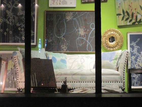J. Latter painted pillows in the window of Harbinger